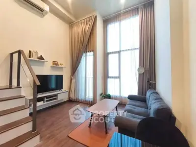 Spacious modern living room with high ceilings and elegant decor