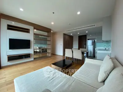 Spacious modern living room with open kitchen and elegant furnishings