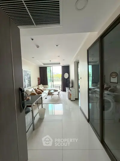 Spacious modern living room with large windows and elegant decor
