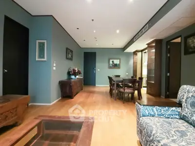 Spacious living room with elegant wooden flooring and stylish furniture
