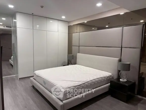 Modern bedroom with sleek design and spacious wardrobe