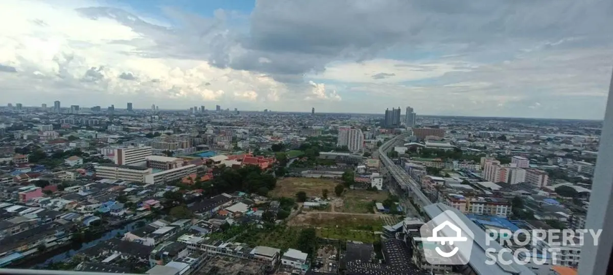 Stunning panoramic cityscape view from high-rise building, showcasing urban skyline and expansive horizon.