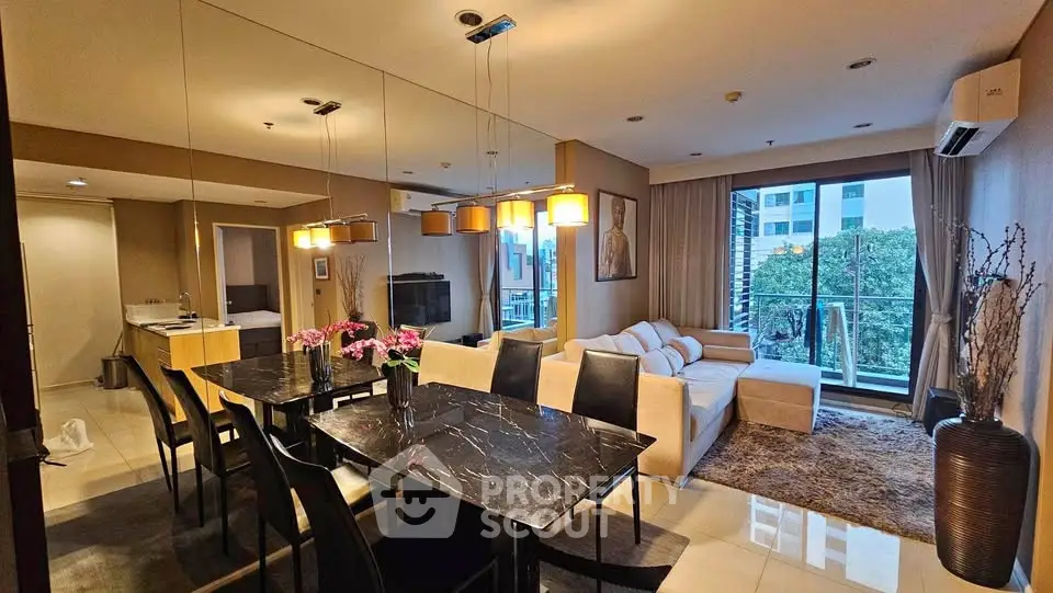Luxurious modern living room with elegant dining area and balcony view