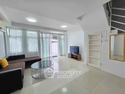 Spacious modern living room with sleek furniture and natural light