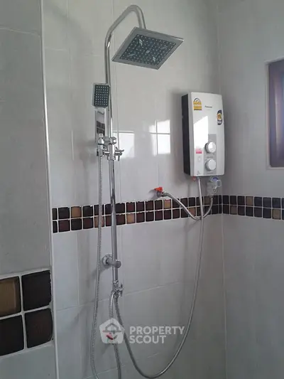 Modern bathroom with sleek shower fixtures and water heater
