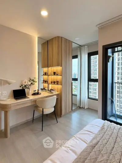 Modern bedroom with study area and city view from balcony