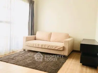 Cozy living room with a stylish sofa and natural light