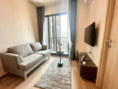 Modern living room with cozy sofa and balcony view