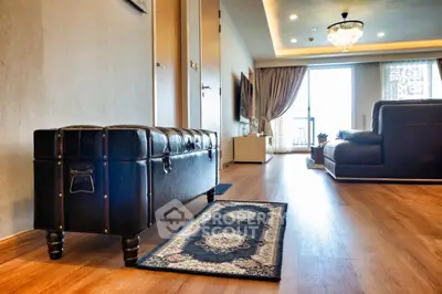 Luxurious living room with elegant decor and spacious layout, featuring a stylish leather bench and modern furnishings.