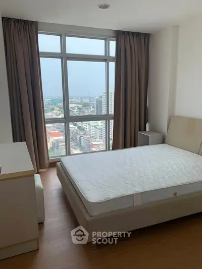 Modern bedroom with stunning city view and large windows