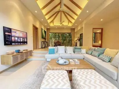 Luxurious open-plan living room with vaulted ceiling and modern decor