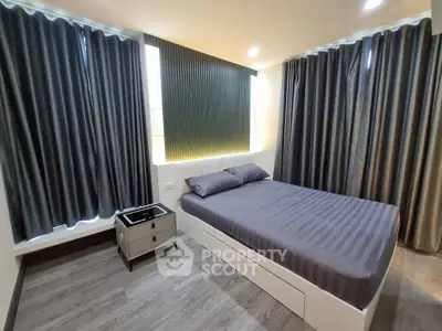 Modern bedroom with sleek design and ample natural light