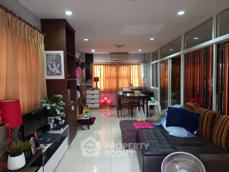 Spacious living room with modern decor and ample natural light