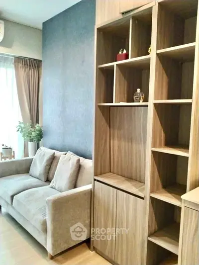 Cozy living room with modern wooden shelving and plush sofa