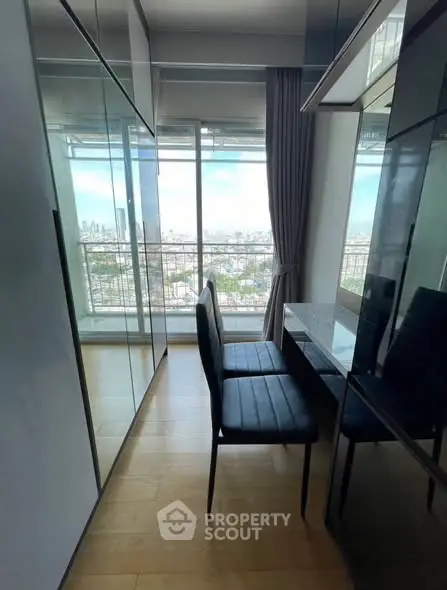 Modern high-rise apartment with stunning city view and sleek interior design.