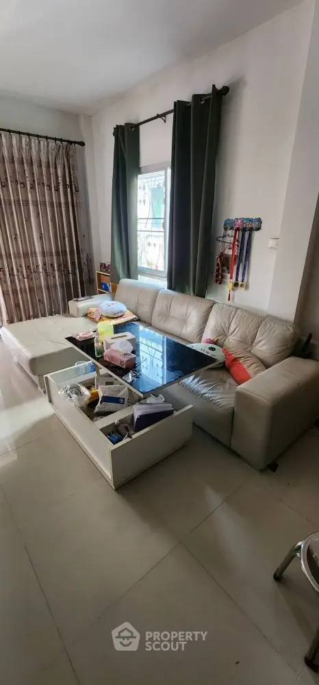 Spacious living room with modern sofa and natural light
