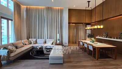 Luxurious modern living room with elegant dining area and high ceilings.