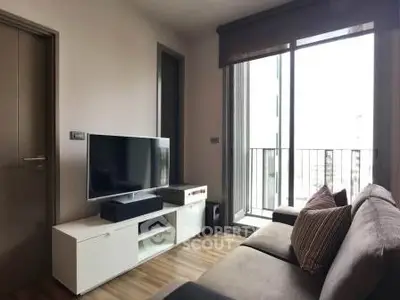 Modern living room with sleek furniture and balcony view, perfect for urban living.