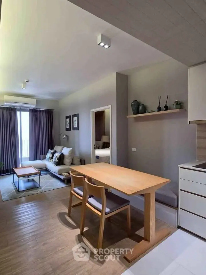 Modern open-plan living room with dining area and stylish decor