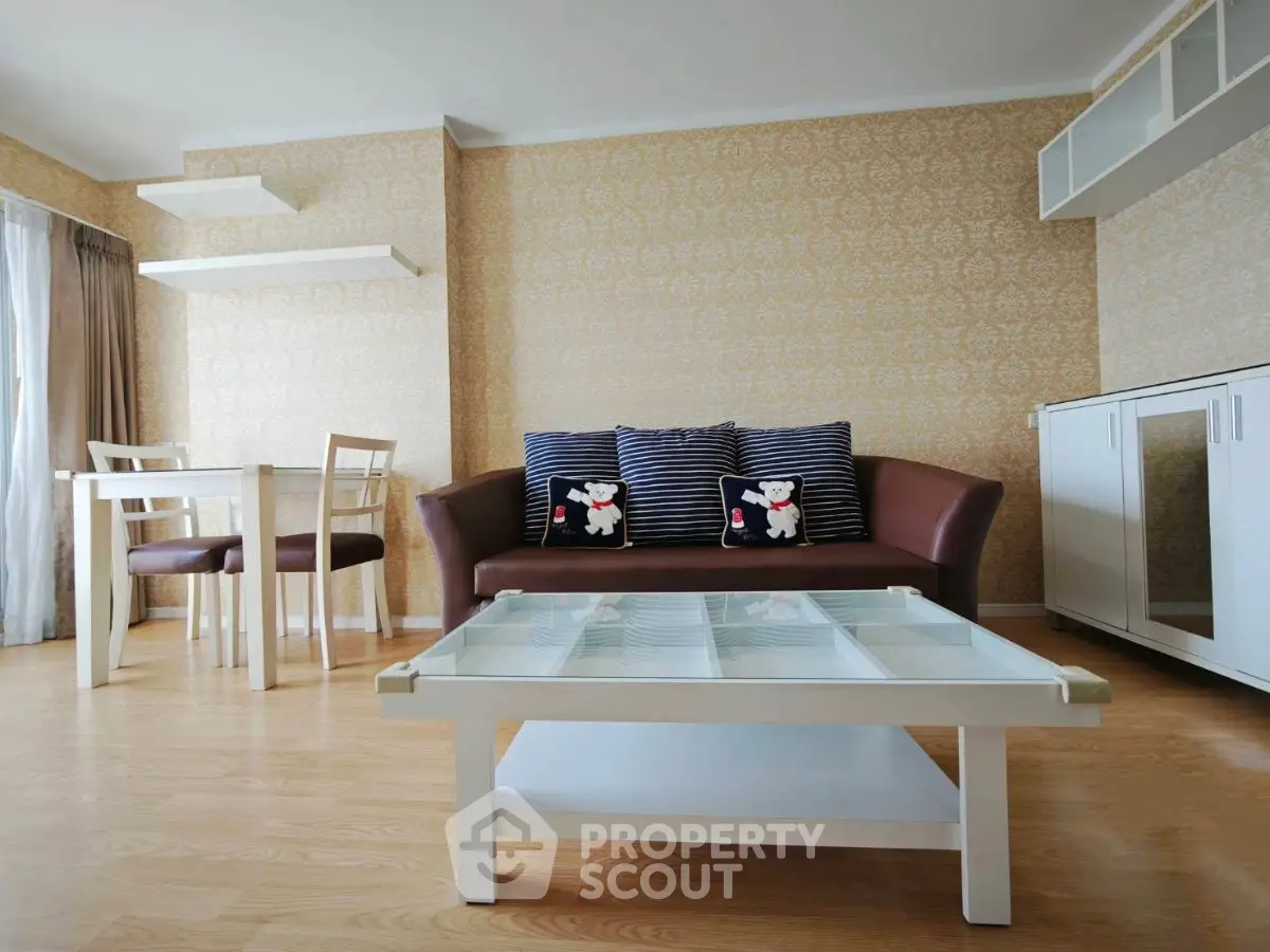 Charming living room with elegant decor and cozy seating in a modern apartment.