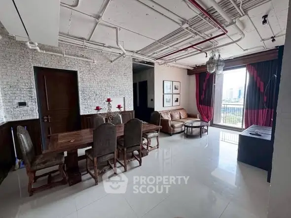 Stylish living room with exposed ceiling, elegant dining set, and city view.