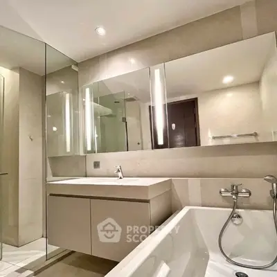 Modern bathroom with sleek fixtures and a bathtub in a luxury apartment.
