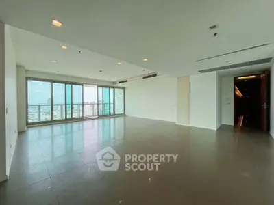 Spacious modern living room with panoramic city views and large windows