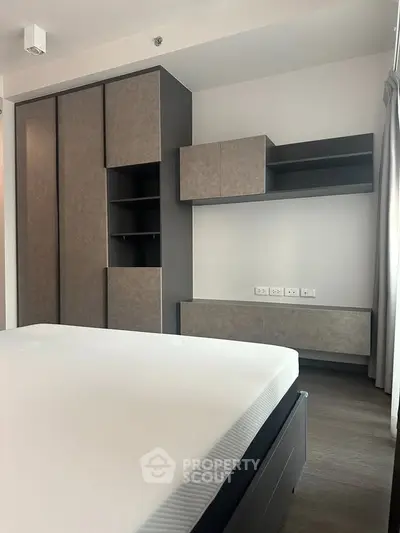 Modern bedroom with sleek built-in wardrobe and minimalist design