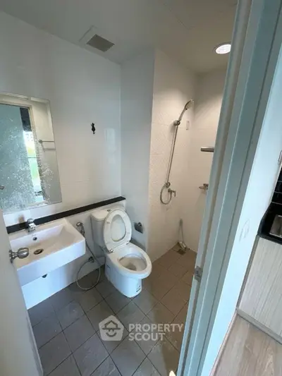 Modern bathroom with shower and toilet in a compact layout