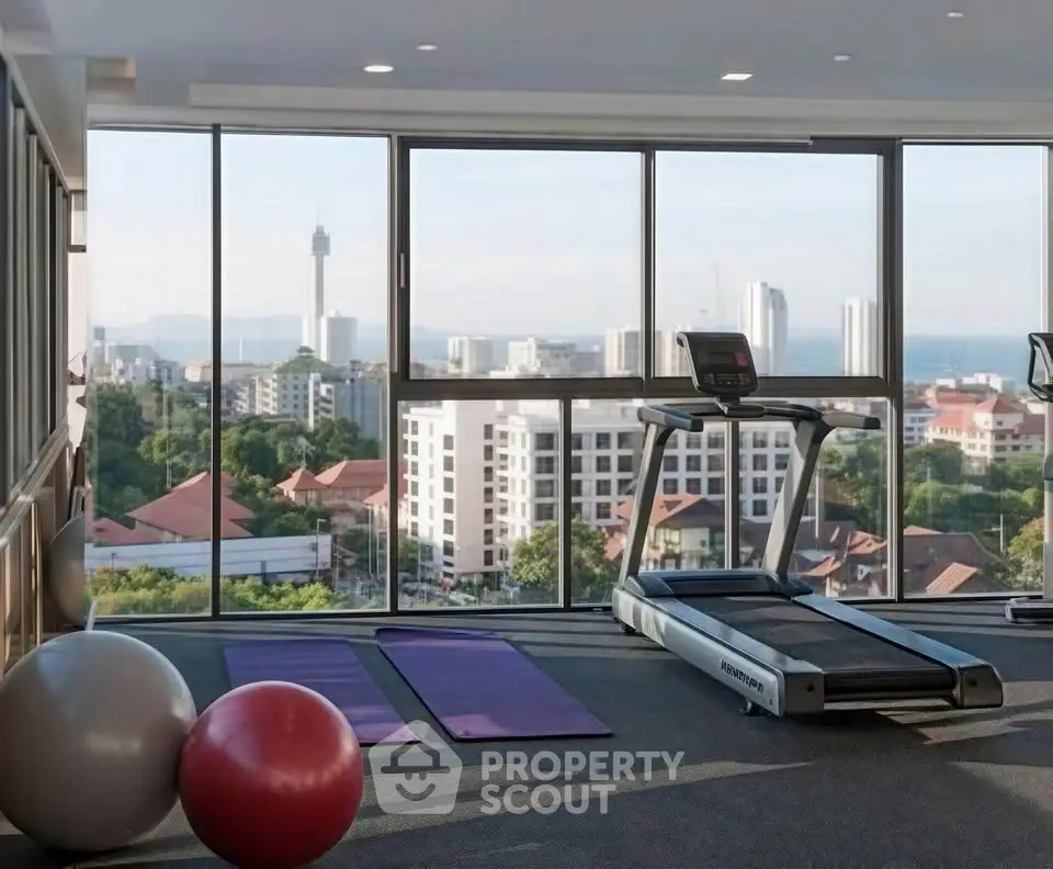 Modern gym with panoramic city view and fitness equipment