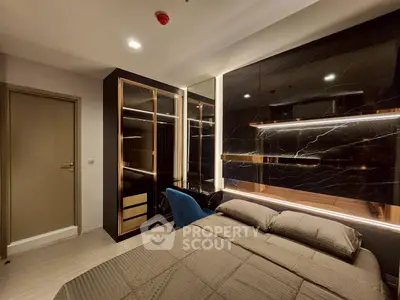 Luxurious modern bedroom with sleek black marble accents and elegant lighting