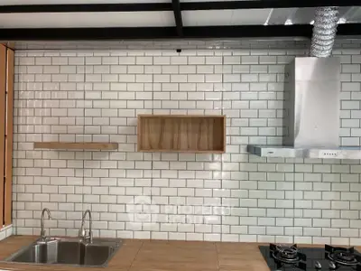 Modern kitchen with sleek gas stove and stylish backsplash