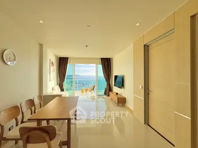 Spacious living room with ocean view and modern furnishings