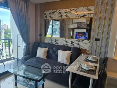 Modern living room with stylish decor and balcony view in a luxury apartment.