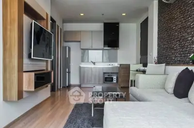 Modern living room with open kitchen layout and stylish decor