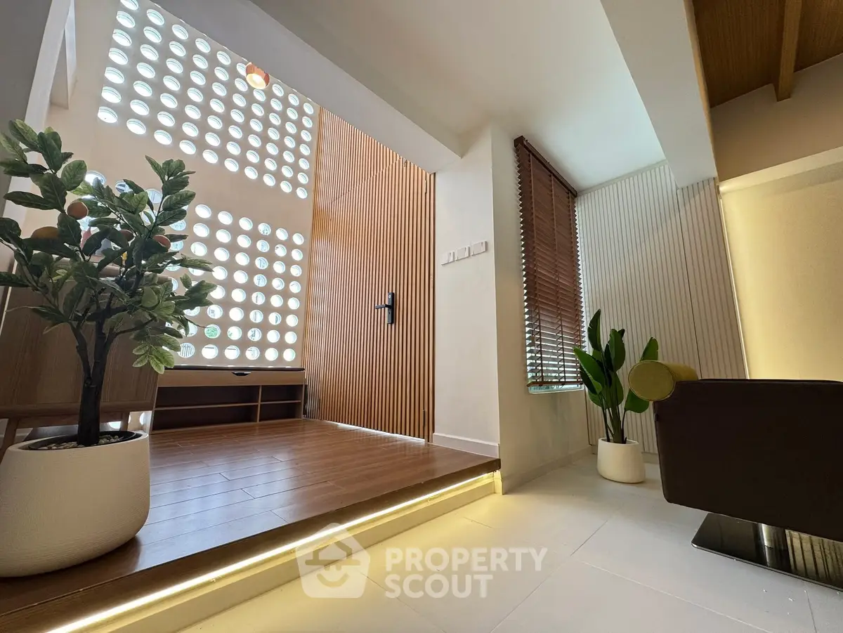 Modern interior with stylish wooden accents and indoor plants