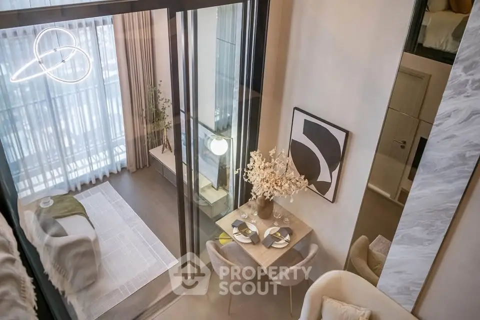 Modern duplex apartment with stylish living and dining area, featuring floor-to-ceiling windows and contemporary decor.