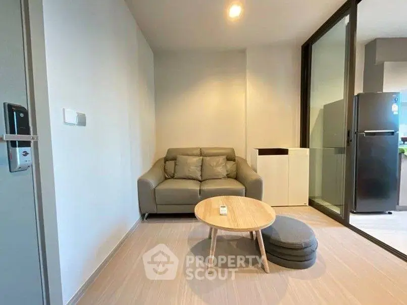 Modern living room with cozy sofa and stylish decor in a contemporary apartment.