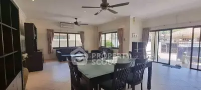 Spacious living room with modern furniture and large windows for natural light.