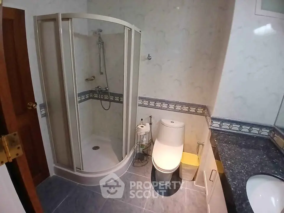 Modern bathroom with shower and elegant tile design