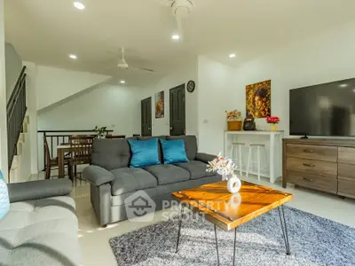 Spacious living room with modern decor and natural light