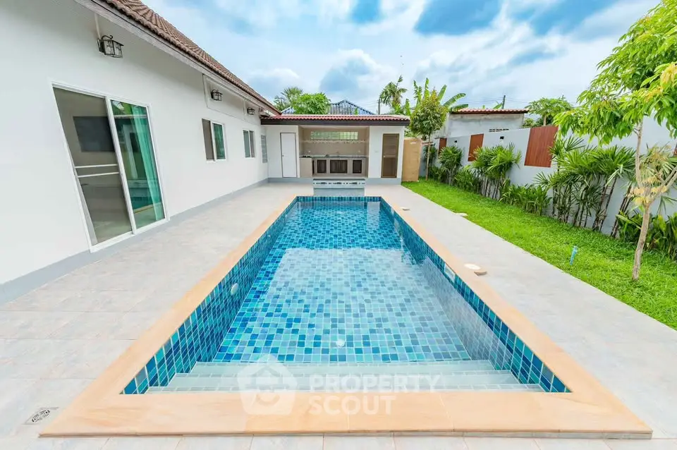 Stunning modern home with private pool and lush garden, perfect for relaxation and entertainment.