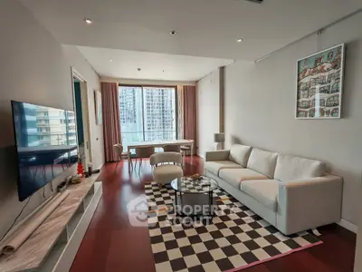 Spacious modern living room with elegant decor and city view, perfect for urban living.