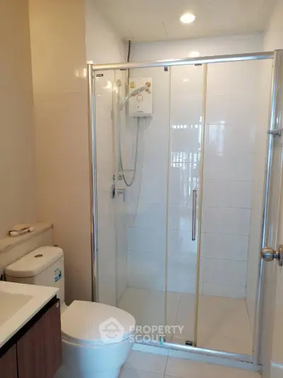 Modern bathroom with glass shower and sleek fixtures