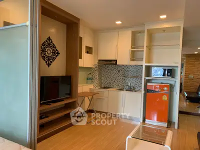 Modern studio apartment with stylish kitchen and cozy living area