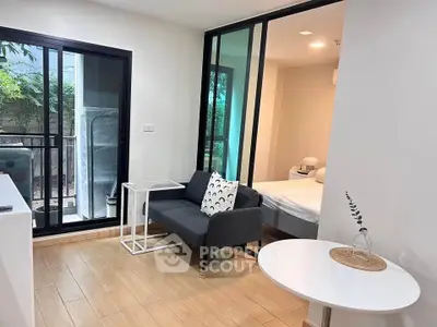 Modern apartment with sliding glass doors and cozy furnishings