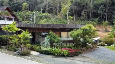 Charming modern house with lush garden and scenic forest backdrop, perfect for nature lovers seeking tranquility.