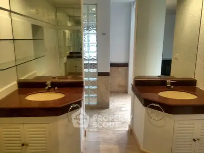 Spacious bathroom with dual sinks and elegant marble countertops
