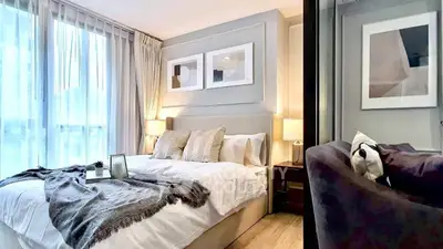 Luxurious modern bedroom with elegant decor and large windows