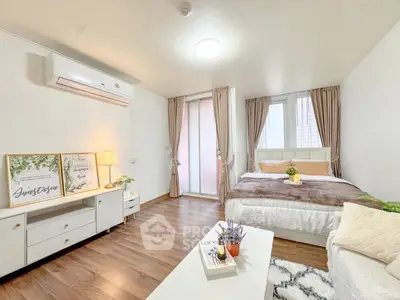 Bright and cozy bedroom with modern decor and natural light, perfect for relaxation.